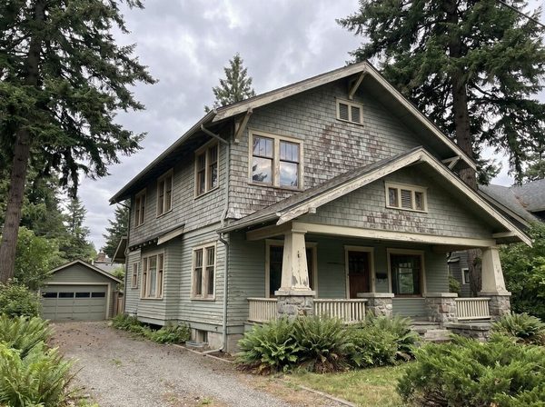 Craftsman exterior before painting, peeling sage siding and weathered trim
